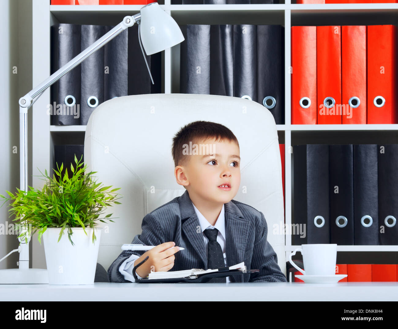 little boy as a businessman, in office Stock Photo - Alamy