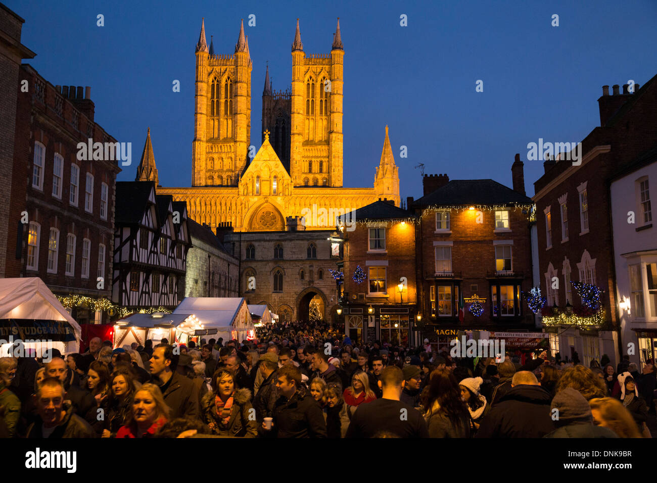 Lincoln German Market. Picture taken from the castle looking towards the Cathedral at sunset when the Cathedral is floodlit. Stock Photo