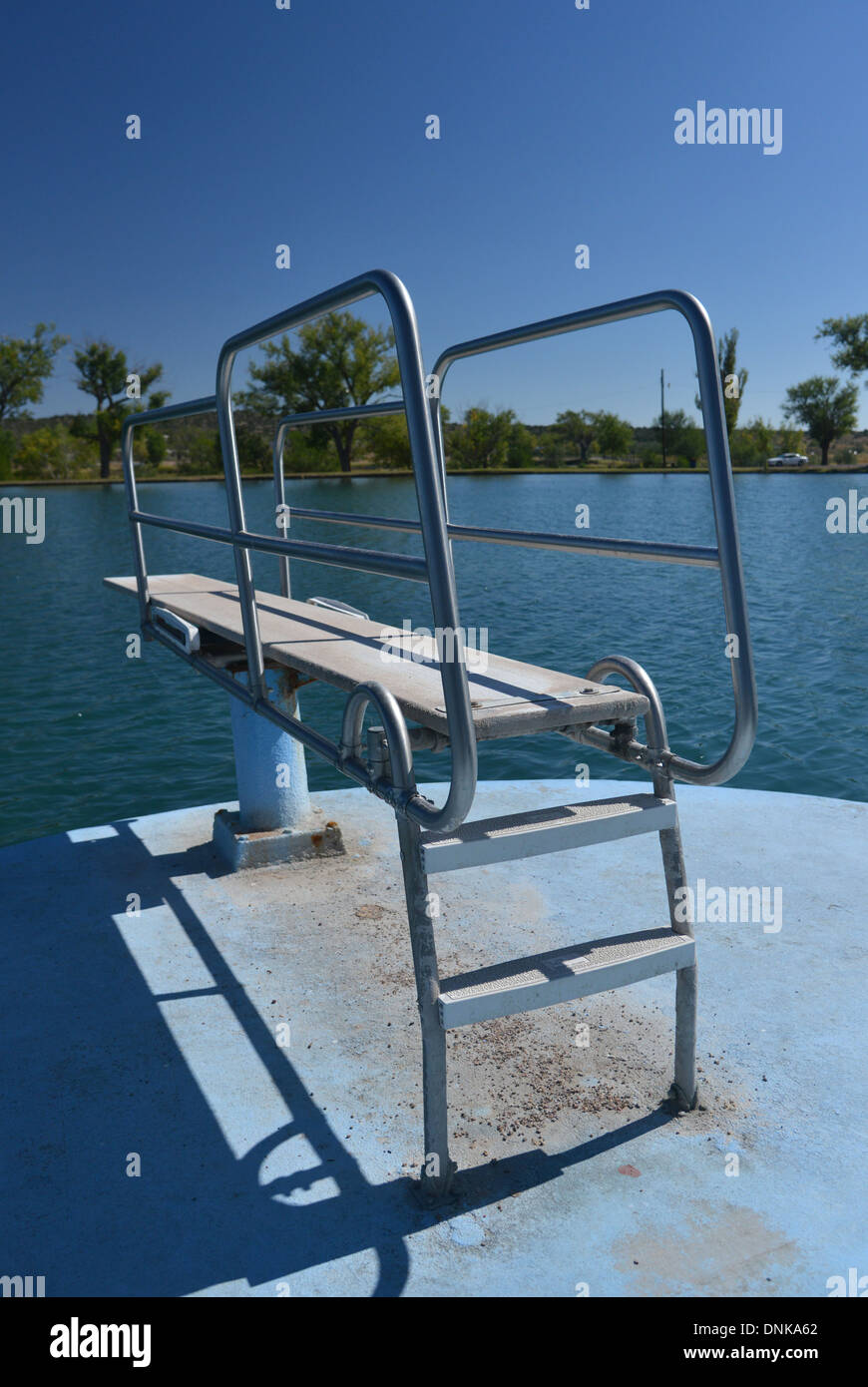 Outdoor diving board at swimming hole in Santa Rosa, New Mexico on old