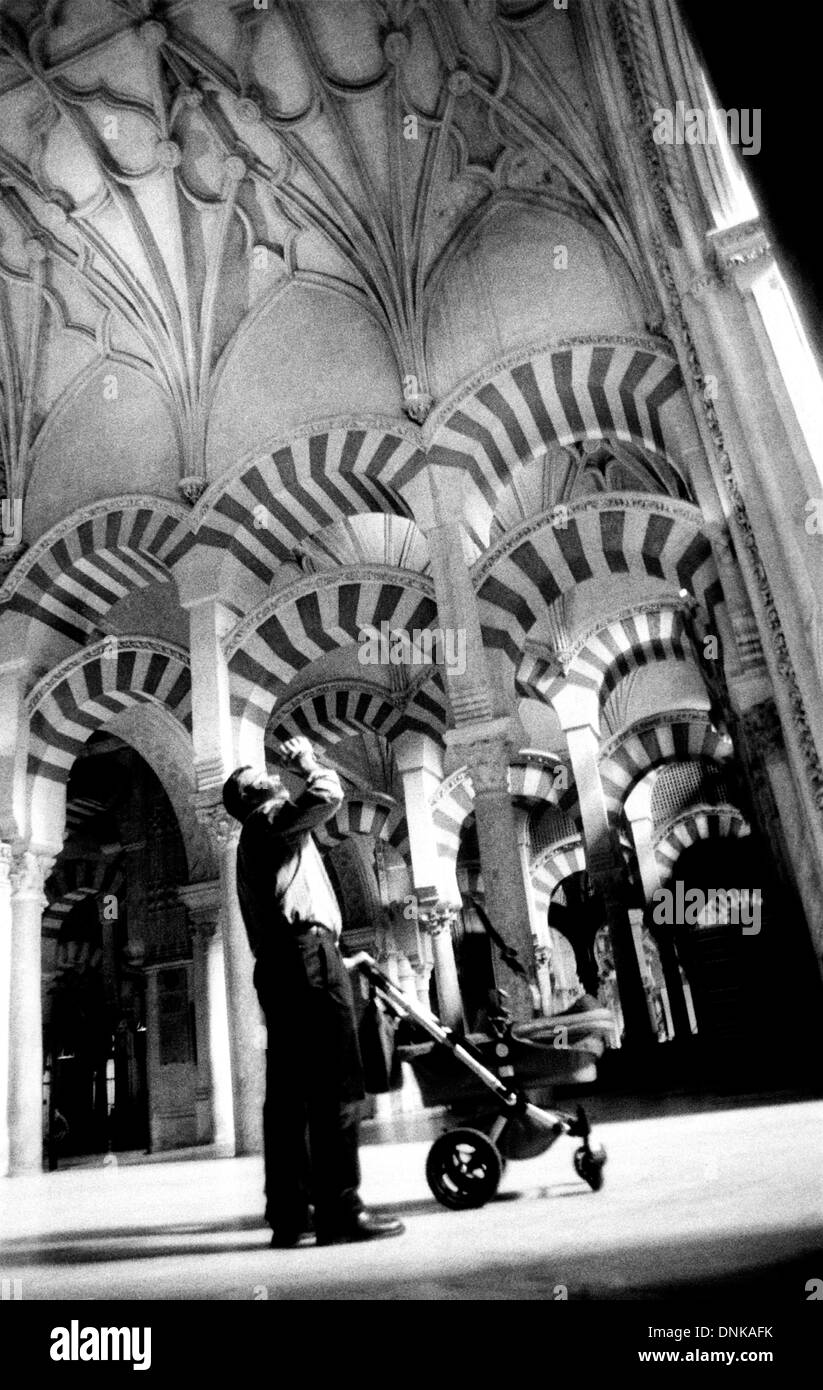 A tourist photographs the ceiling of Cordoba's Cathedral in Andalucia, Spain, March 2005. Stock Photo