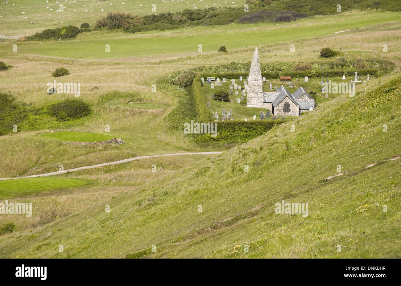 St Enodoc Church, Trebetherick, set within a green landscape. Cornwall, UK. Stock Photo