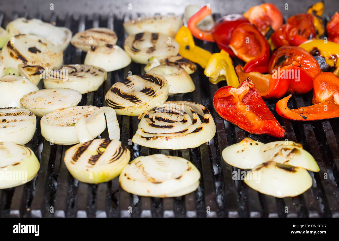 cooking vegetables on the grill in the kitchen at the restaurant Stock Photo