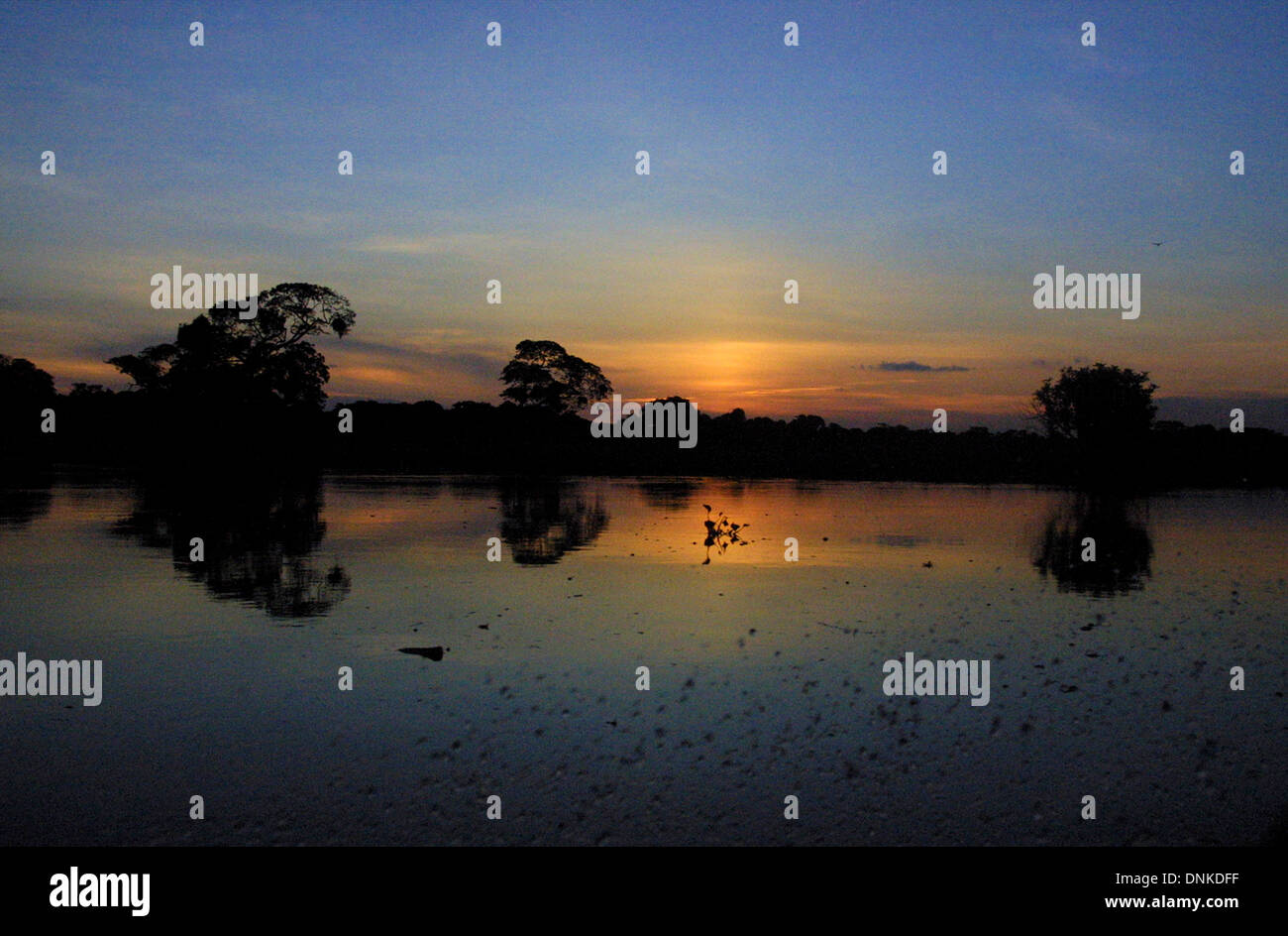 The Portuguesa River reflects the sunset in Venezuela's Los LLanos plains in Guarico State, Sept. 14, 2002. Stock Photo