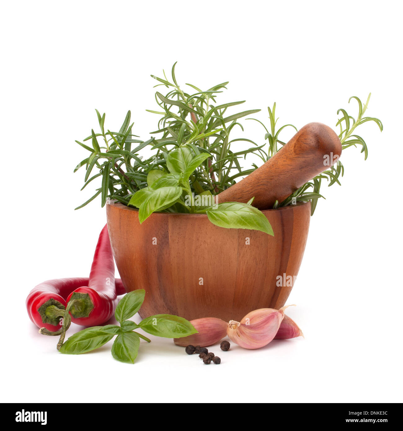 fresh flavoring herbs and spices in wooden mortar isolated on white ...