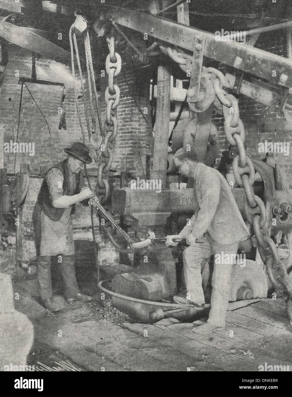 Bringing scraped ends of link together for welding - Anchor chain making 1909 Stock Photo