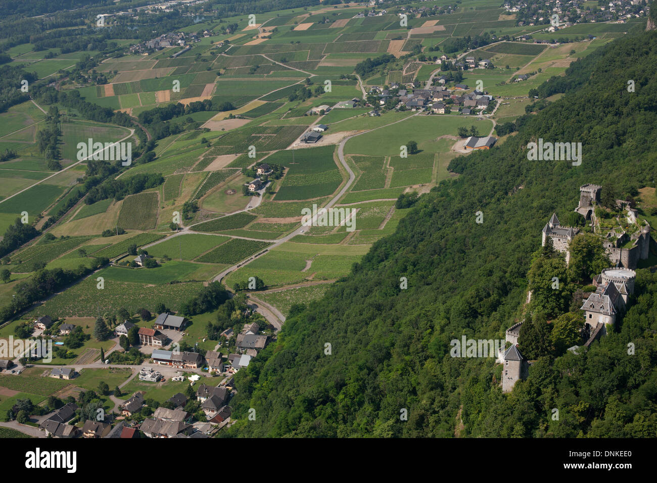 AERIAL VIEW. Miolans Castle overlooking the vineyards of the Isère Valley. Saint-Pierre d'Albigny, Savoie, Auvergne-Rhône-Alpes, France. Stock Photo