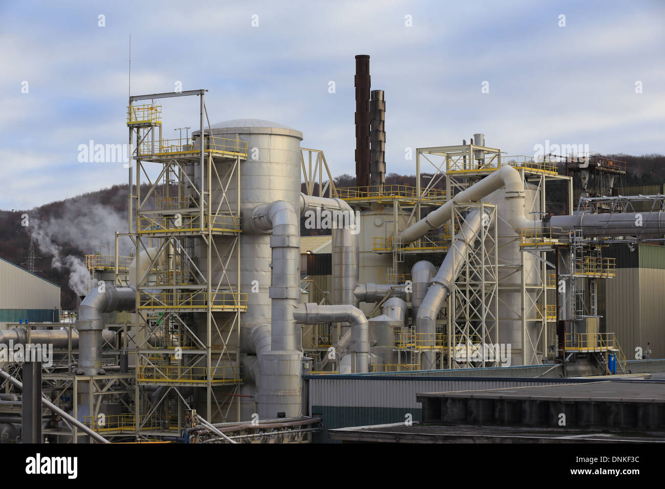 Chemical factory structures with tanks, pipelines, chimney. landscape, nobody Stock Photo