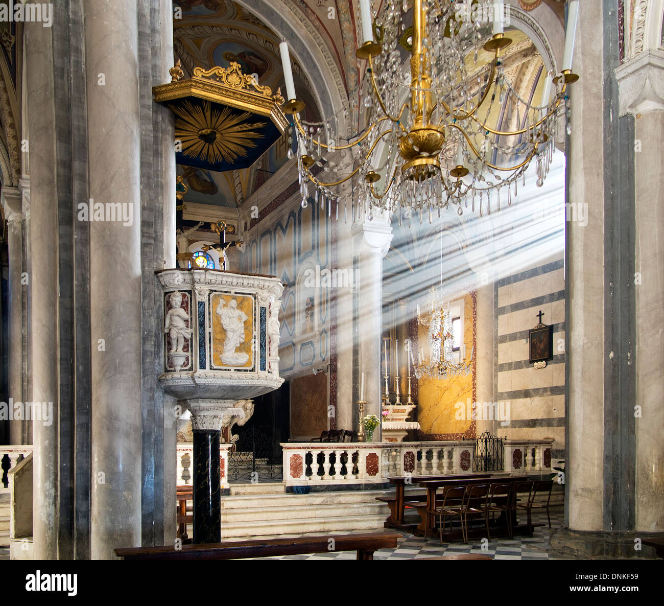 Church interior - light rays perfectly aligned. Corniglia, Cinque Terre, Italy. Stock Photo