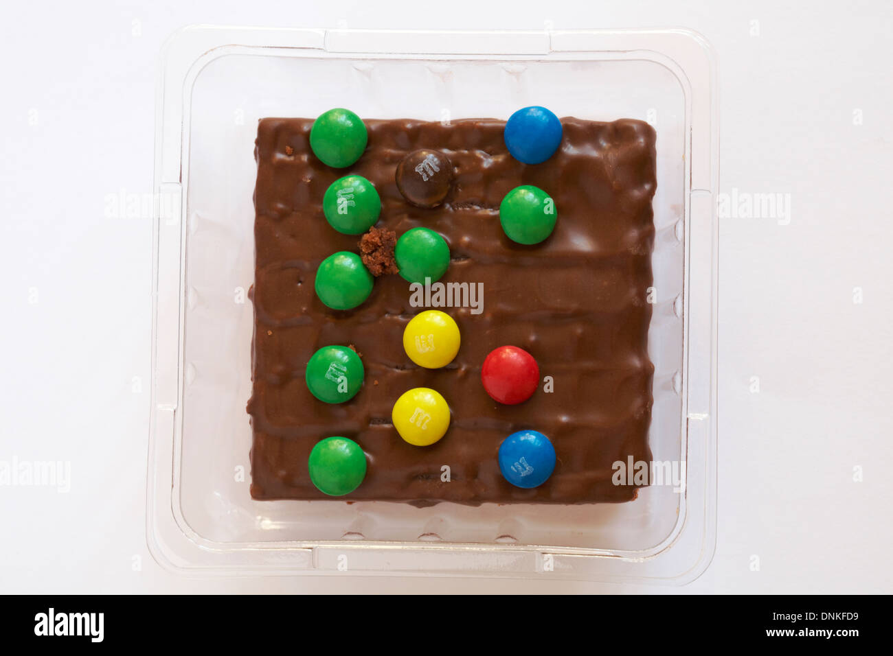 choco M&Ms chocolate brownie - a delicious chocolate brownie topped with  milk chocolate and mini M&M's on white background Stock Photo - Alamy