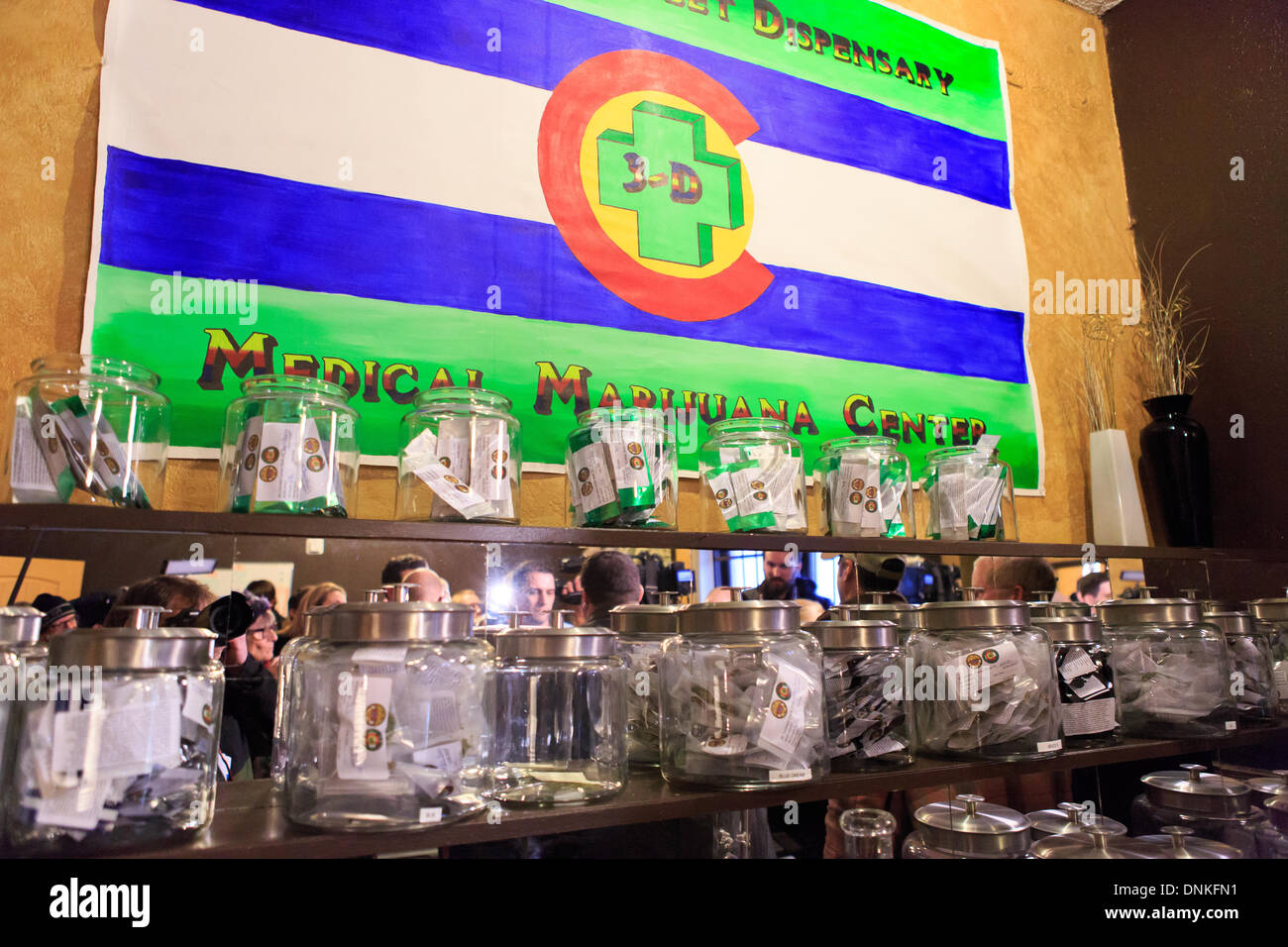 Denver, Colorado USA 1 Jan 2014 – Jars filled with packets of retail marijuana await sale at the 3-D Cannabis dispensary on the first day of legalization in Colorado. Credit:  Ed Endicott/Alamy Live News Stock Photo
