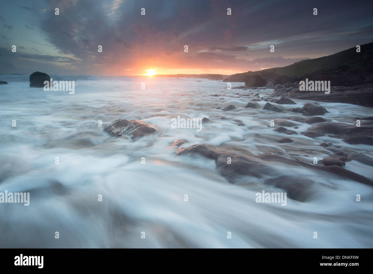 Slow shutter speed picture of Freshwater West at sunset Stock Photo - Alamy