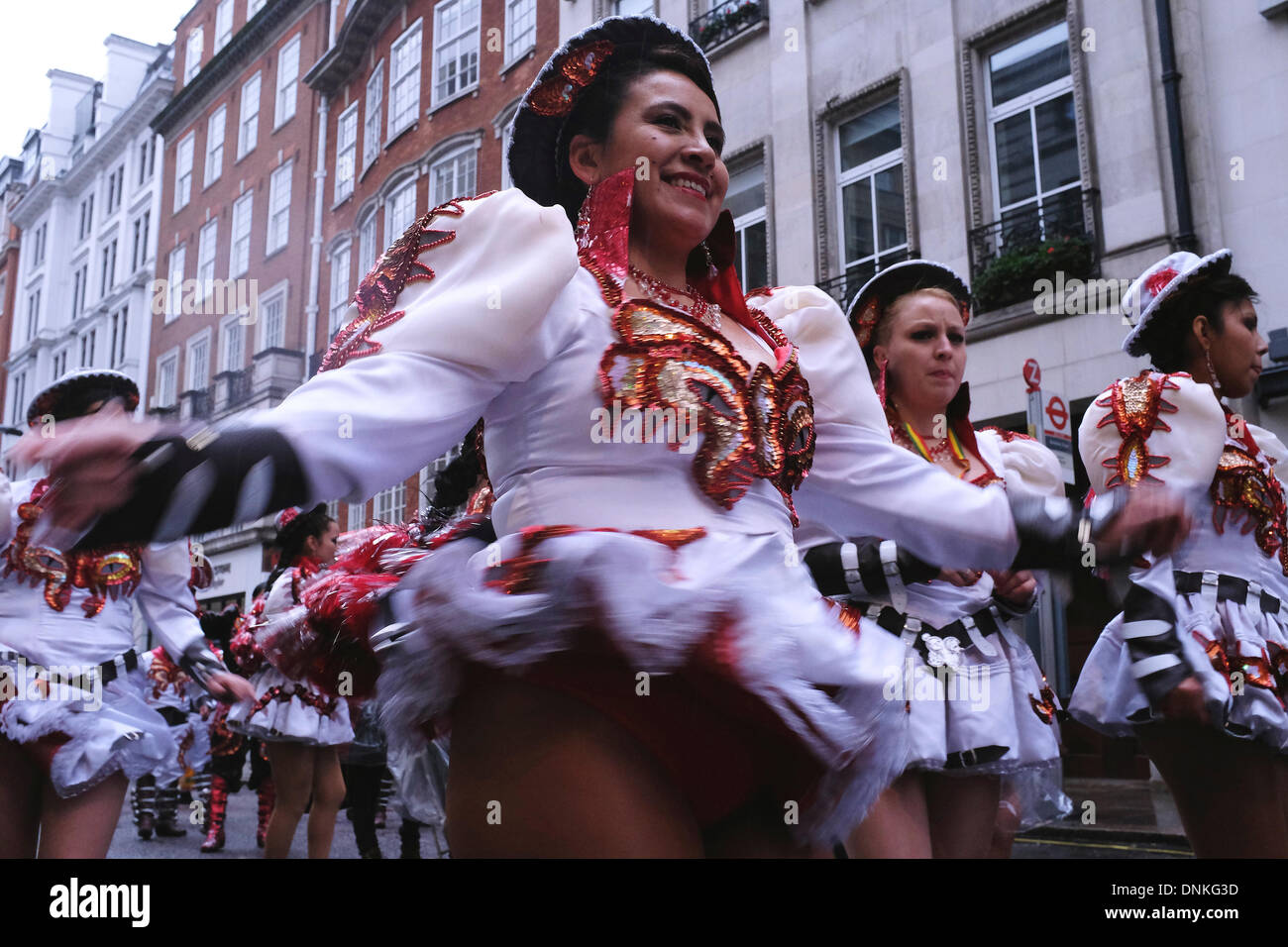 Dance group Bolivian Heritage performs at the 2014 New Year's Day in London Participants and spectators  faced wind, rain and cold on the streets of the capital. Stock Photo