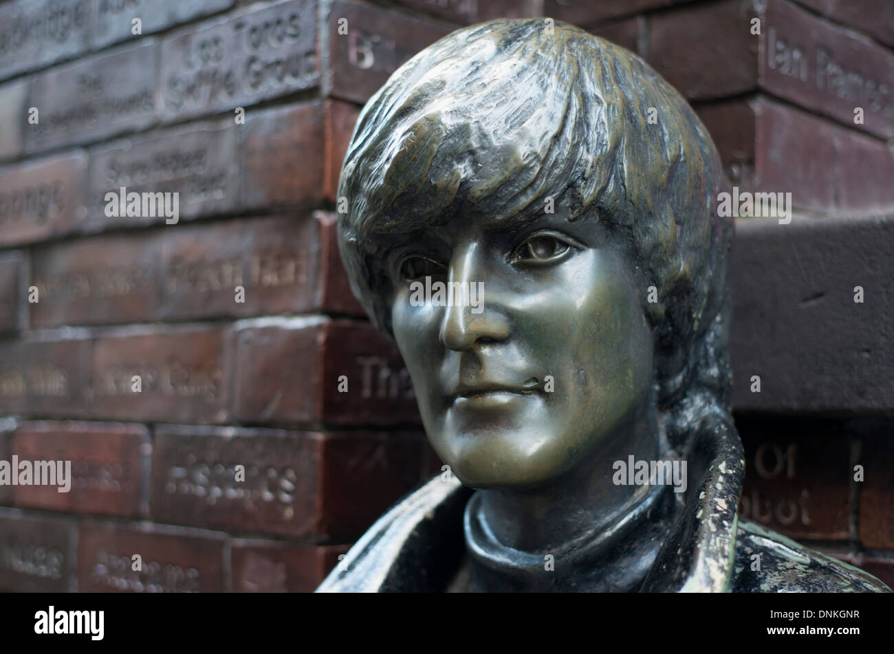 Statue of John Lennon by the Cavern wall of fame on Mathew Street