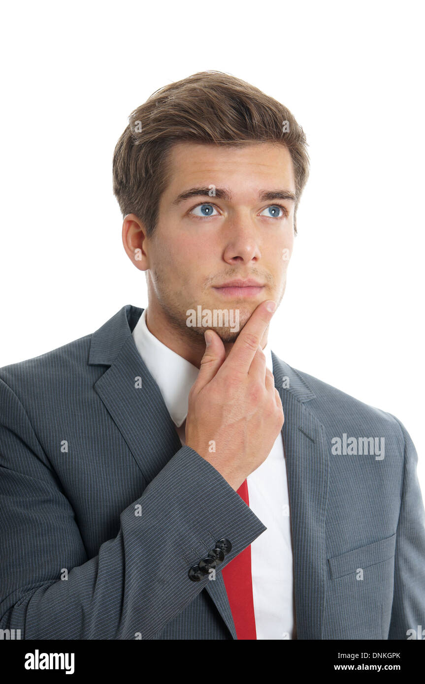 young businessman lost in thought Stock Photo
