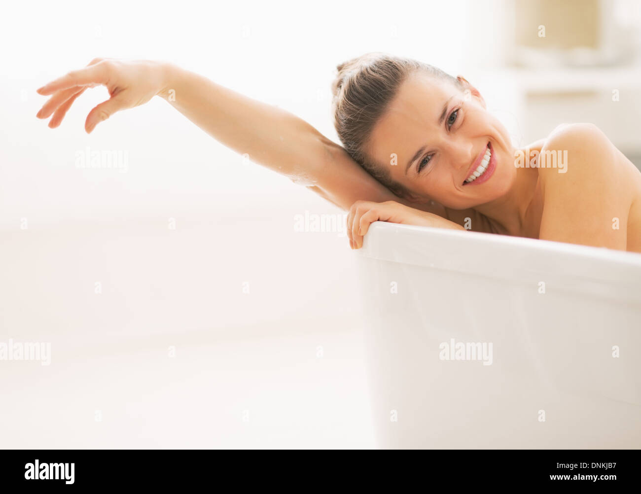 Smiling woman in bathtub hi-res stock photography and images - Alamy