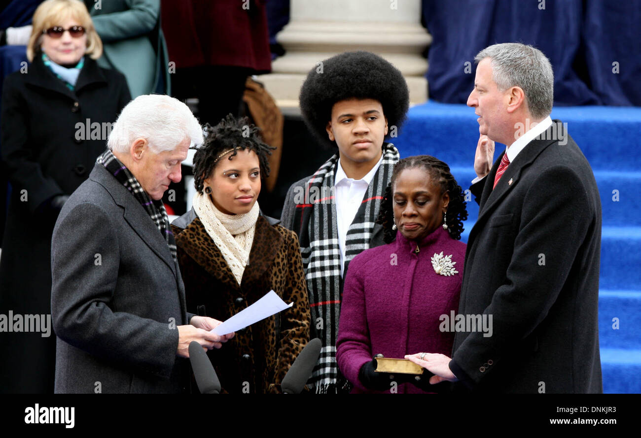 New York, USA. 1st Jan, 2014. Bill de Blasio (1st R) swears in as New York's 109th mayor with the oath administration of former President Bill Clinton (1st L) at the City Hall of New York City, the United States, Jan. 1, 2014. Credit:  Wu Xia/Xinhua/Alamy Live News Stock Photo