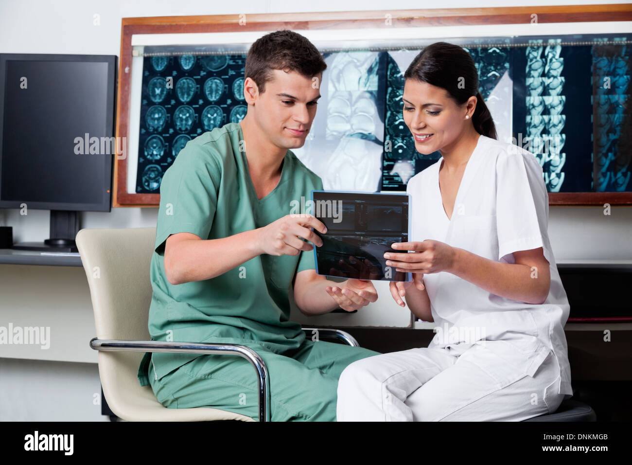 Medical Technicians Looking At X-ray Stock Photo