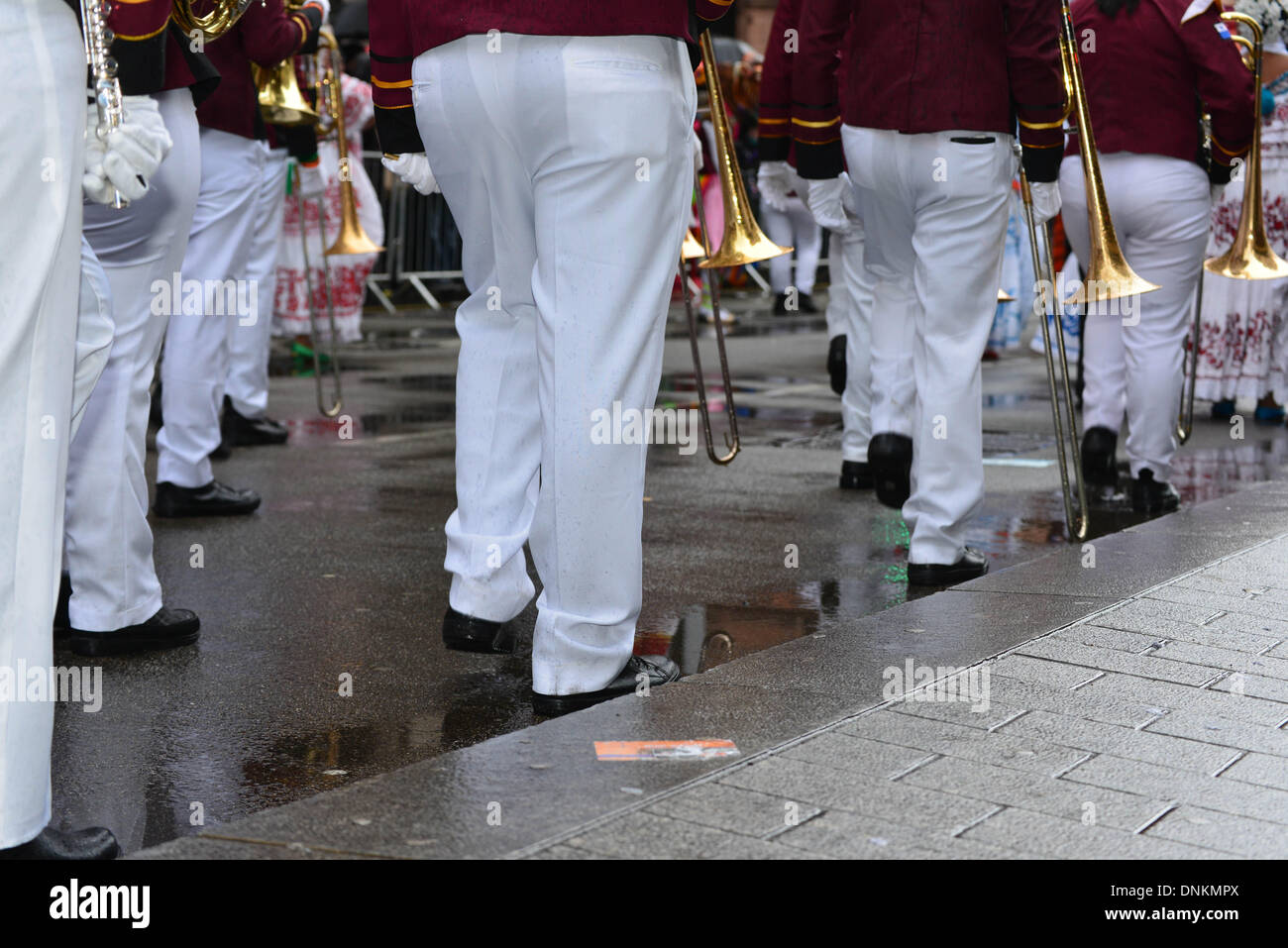 London, UK. 1st January 2014. Tens of thousands of people braved dreadful weather in central London this afternoon for the capital's annual New Year's Day parade, January 1st 2014, Photo by See li/Alamy Live News Stock Photo
