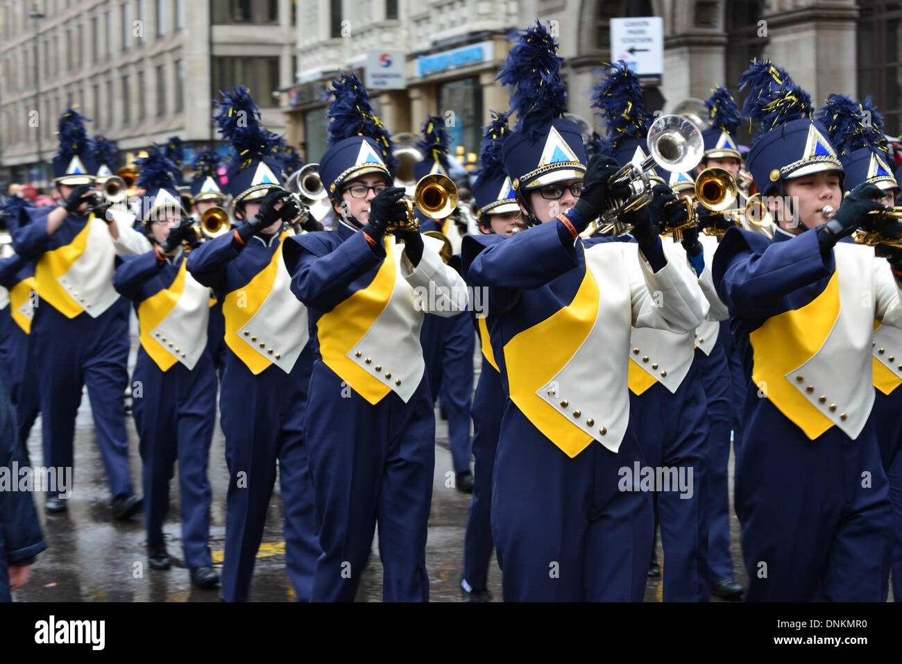London, UK. 1st January 2014. Tens of thousands of people braved dreadful weather in central London this afternoon for the capital's annual New Year's Day parade, January 1st 2014, Photo by See li/Alamy Live News Stock Photo