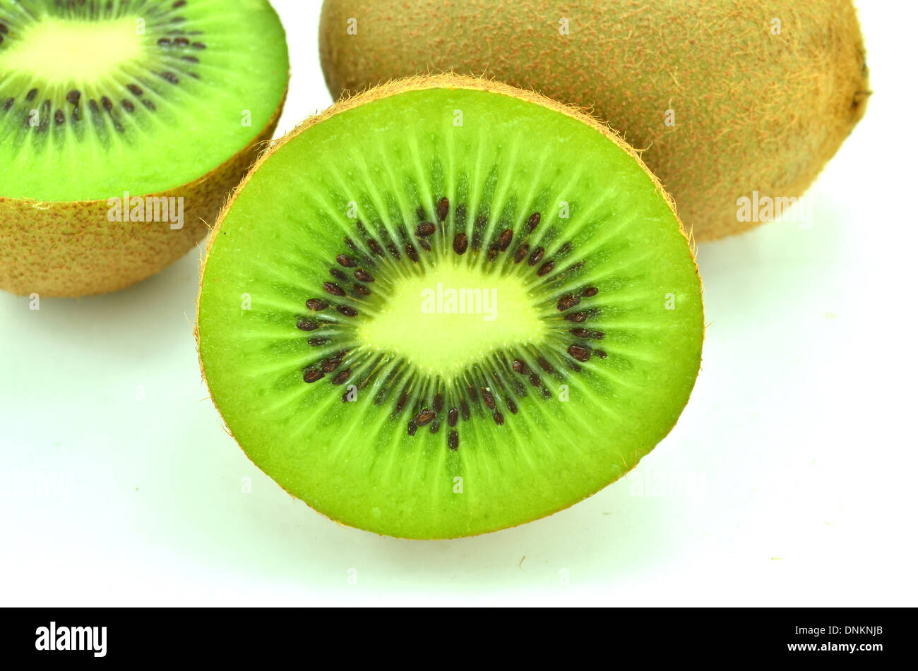 Whole kiwi fruit and his sliced segments isolated on white background Stock Photo