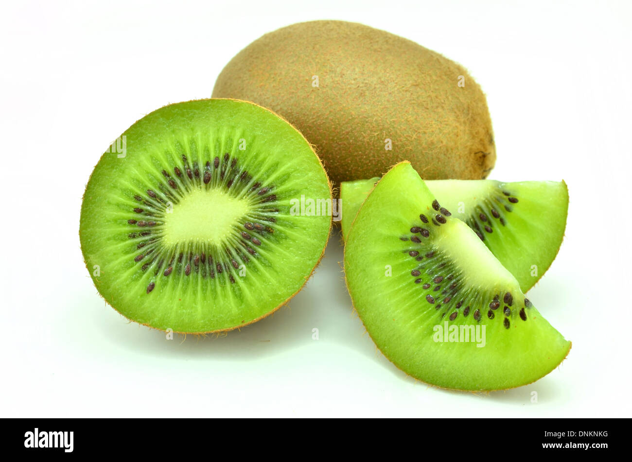Whole kiwi fruit and his sliced segments isolated on white background Stock Photo