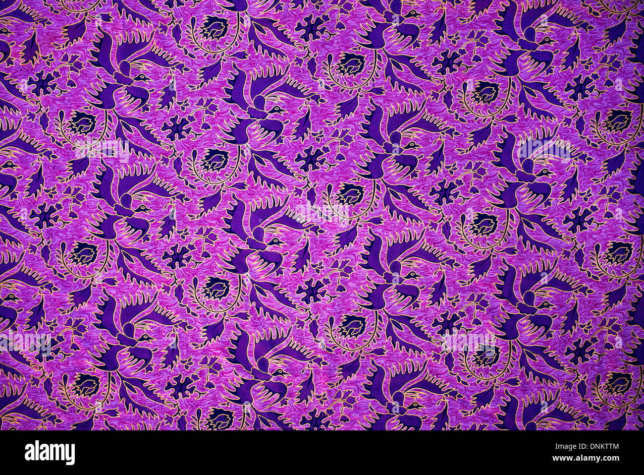 Purple bird fabric pattern on Indian Cotton Sari Stock Photo