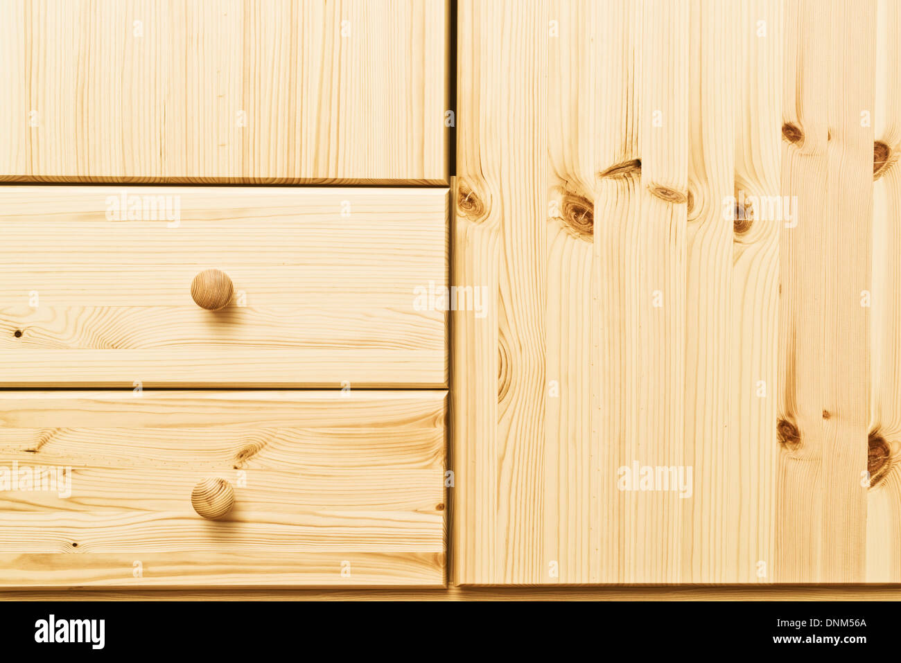 Wooden cabinet drawers with detailed natural wood texture. Home furnishing. Stock Photo