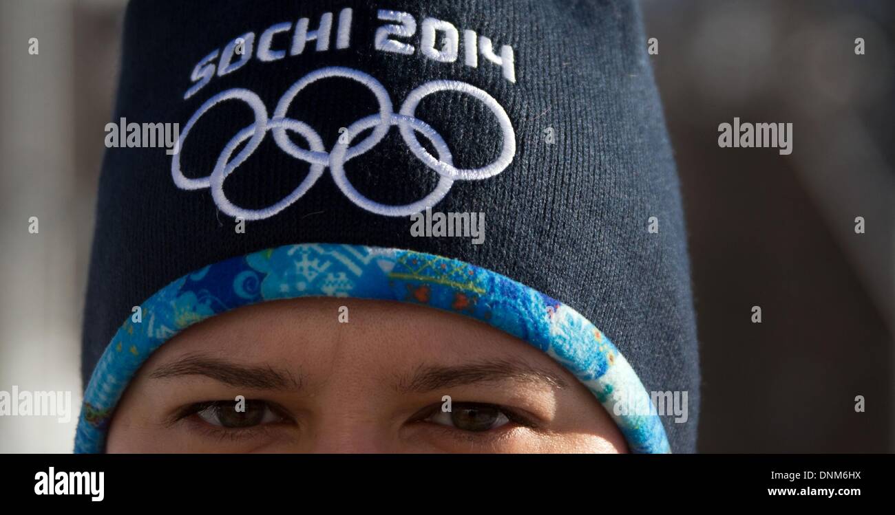 A woman wears a Sochi 2014 hat with the Olympic Rings at the Laura Biathlon & Ski Complex in Krasnaya Polyana, Russia, 18 December 2013. Sochi will host the Winter Olympic Games from 07 to 23 February 2014. Photo: Jens Buettner Stock Photo