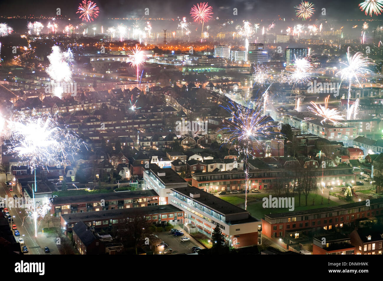 Fireworks on new years eve as seen from a 101 meters high building in the center of Enschede in the Netherlands Stock Photo