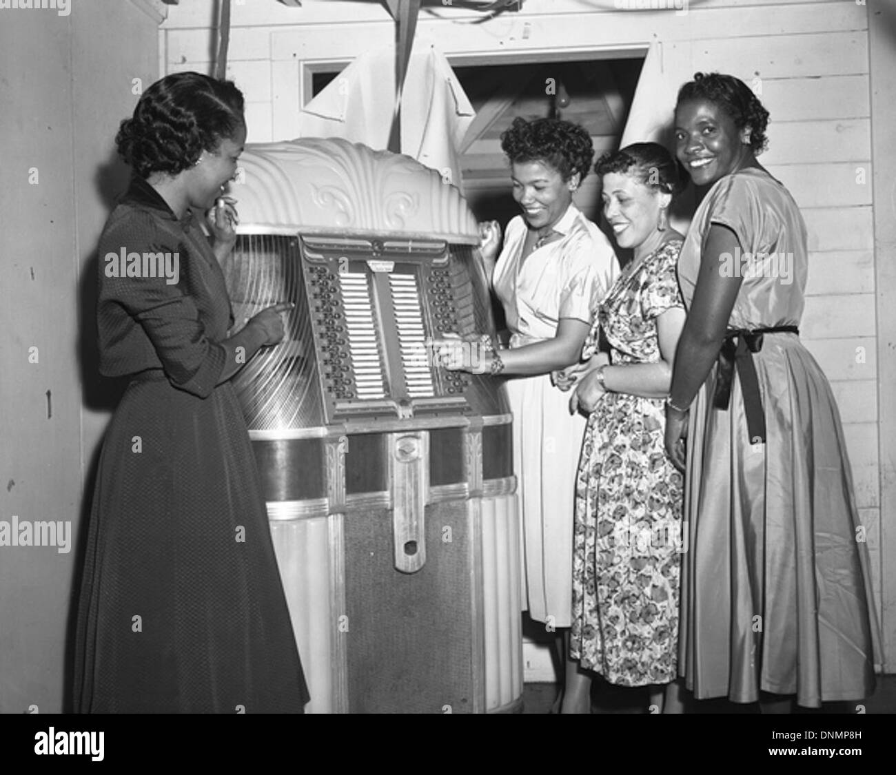 Women at the jukebox during a New Year's Eve part in Tallahassee, Florida Stock Photo