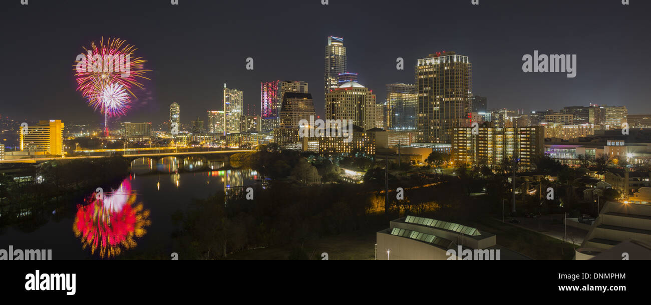 Fireworks explode over the Austin skyline and Ladybird Lake as Austin usher in a new year, 2014, and says goodbye to 2013. Stock Photo