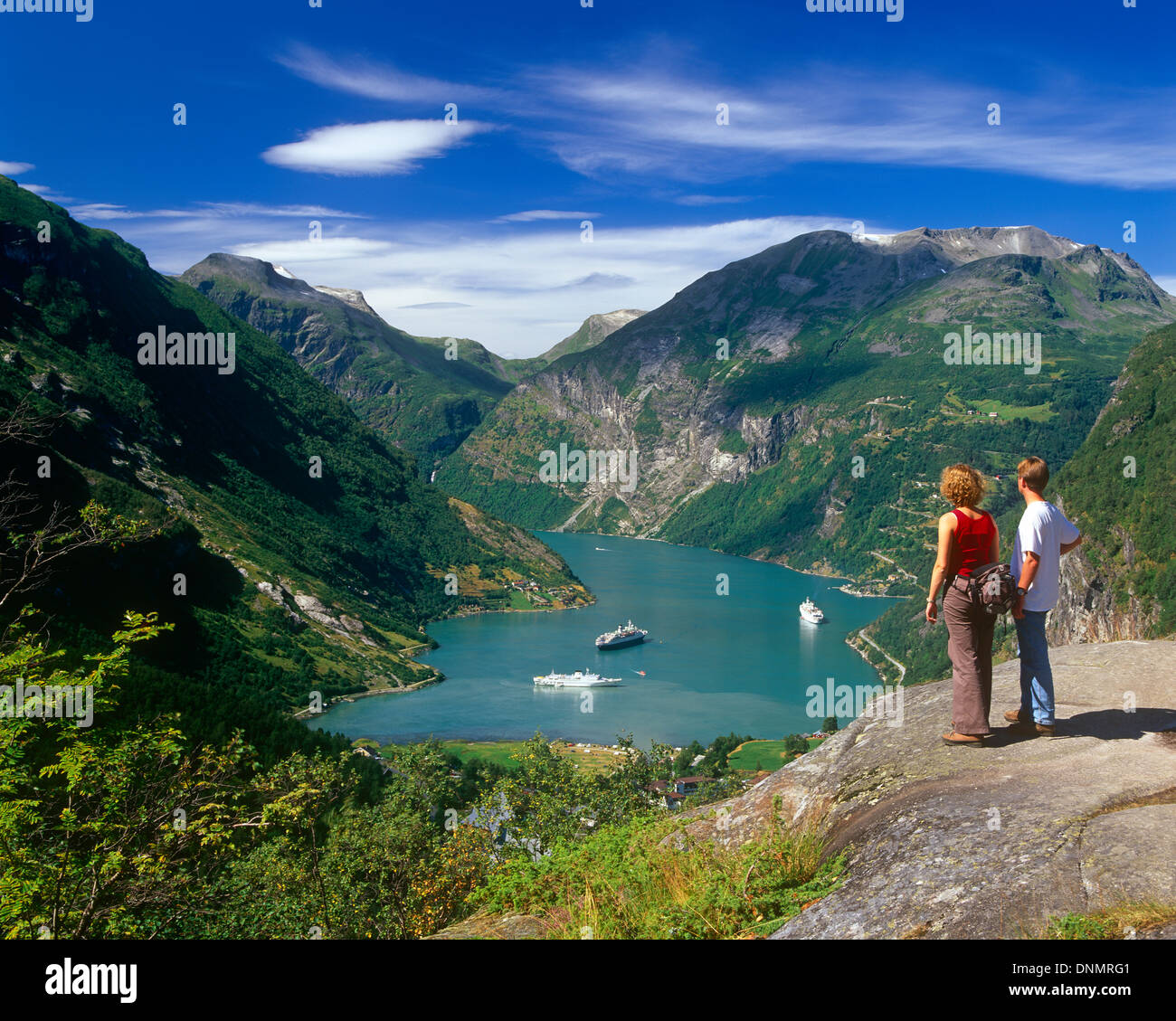 Tourists admiring the view of Geirangerfjord, More og Romsdal, Norway Stock Photo