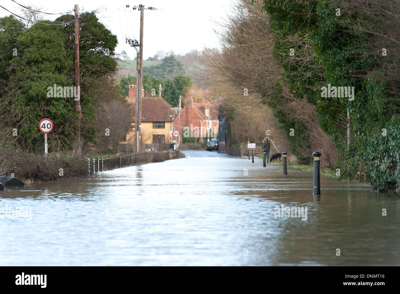 Yalding, Kent, UK. 2nd January 2014. The Environment Agency has issued a flood warning for Yalding Village in County of Kent the first one for 2014 on Thursday 2nd January. The Hampstead lock and flood barriers are overflowing unable to deal with the volume of flood water. Credit:  Yon Marsh/Alamy Live News Stock Photo
