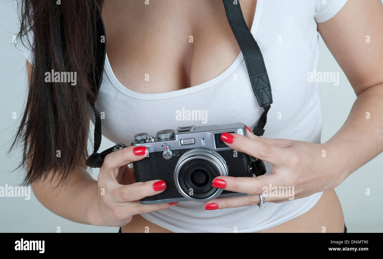 Young woman using a compact camera Stock Photo