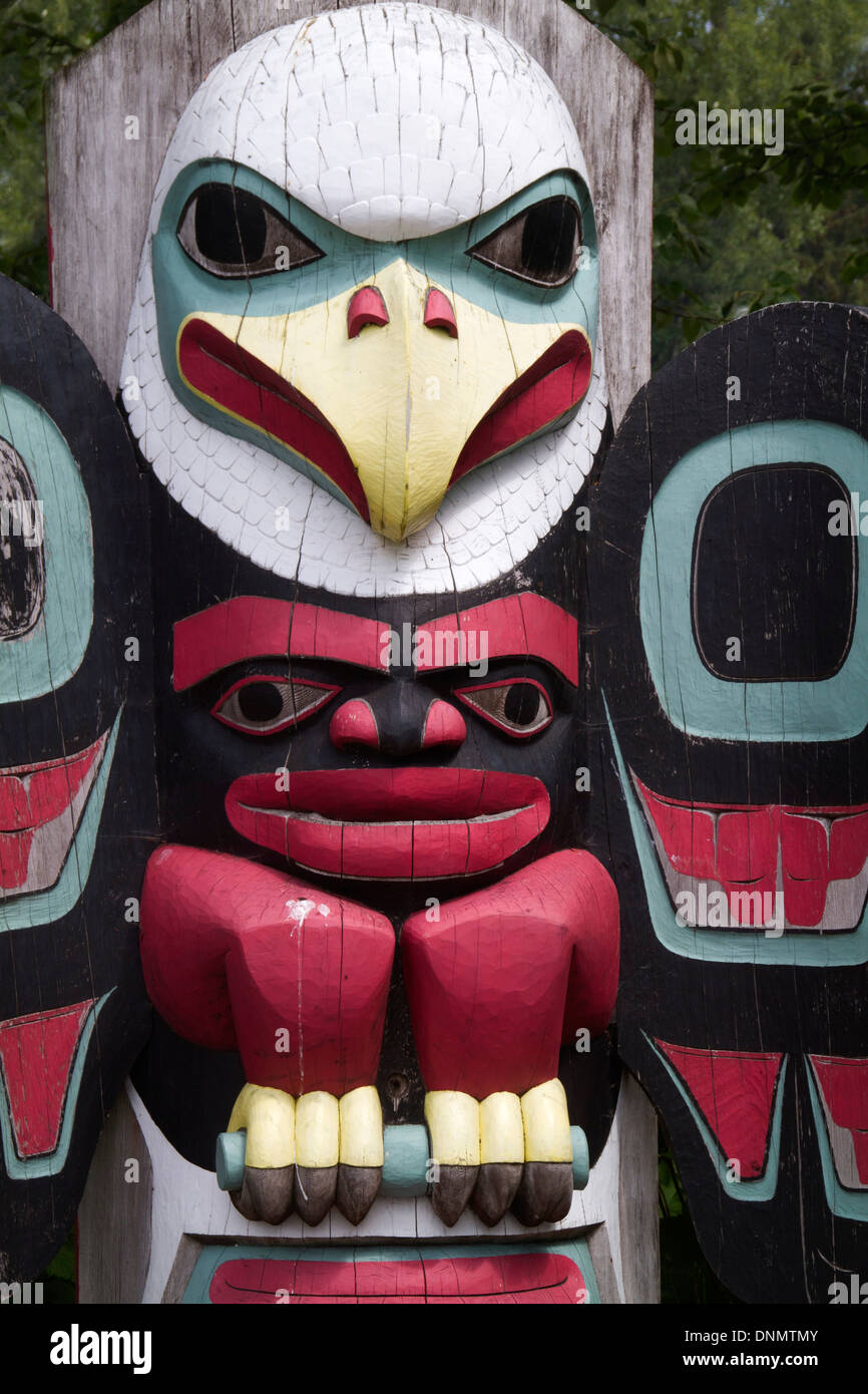 Totem Pole showing a carved eagle by the Tlingit first nation people (natives).Icy Point,Alaska Stock Photo