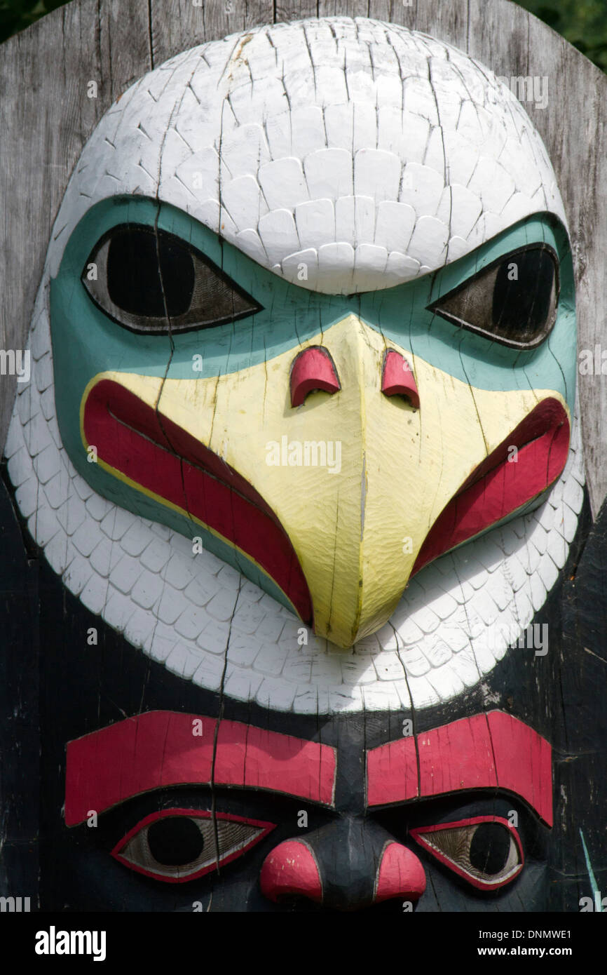 Closeup of totem Pole showing a carved eagle by the Tlingit first nation people (natives).Icy Point,Alaska Stock Photo