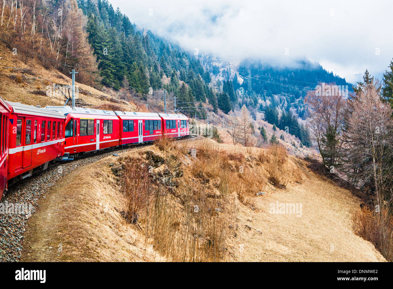 Bernina Express, traveling from Lugano to St. Moritz, near Bernina Pass, Switzerland, Europe Stock Photo