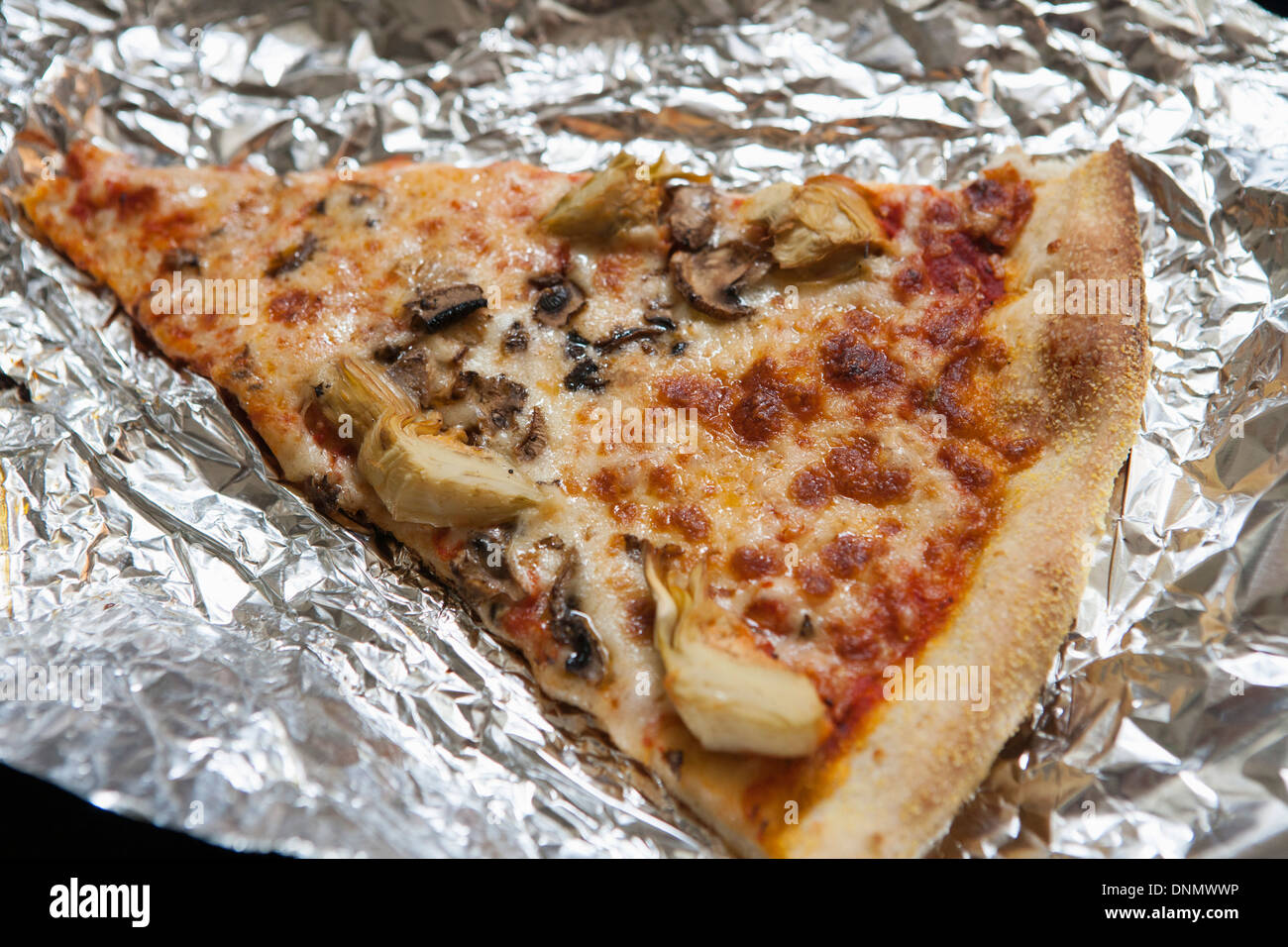 Pizza Slice on Aluminum Foil Stock Photo Alamy