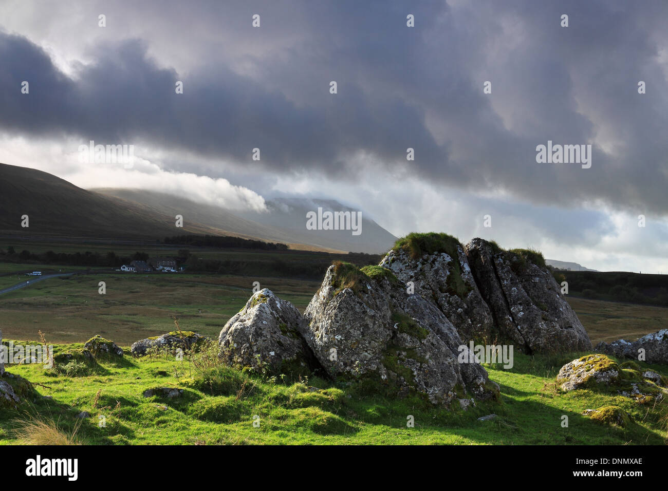 Storm clouds gather over the summit of Ingleborough, one of the Yorkshire Three Peaks mountains in the Yorkshire Dales, England Stock Photo