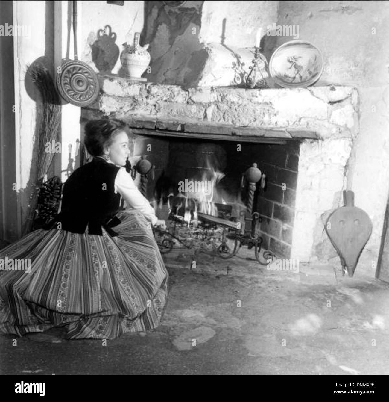 Reenactor beside the fireplace at the González-Alvarez House: St. Augustine, Florida Stock Photo