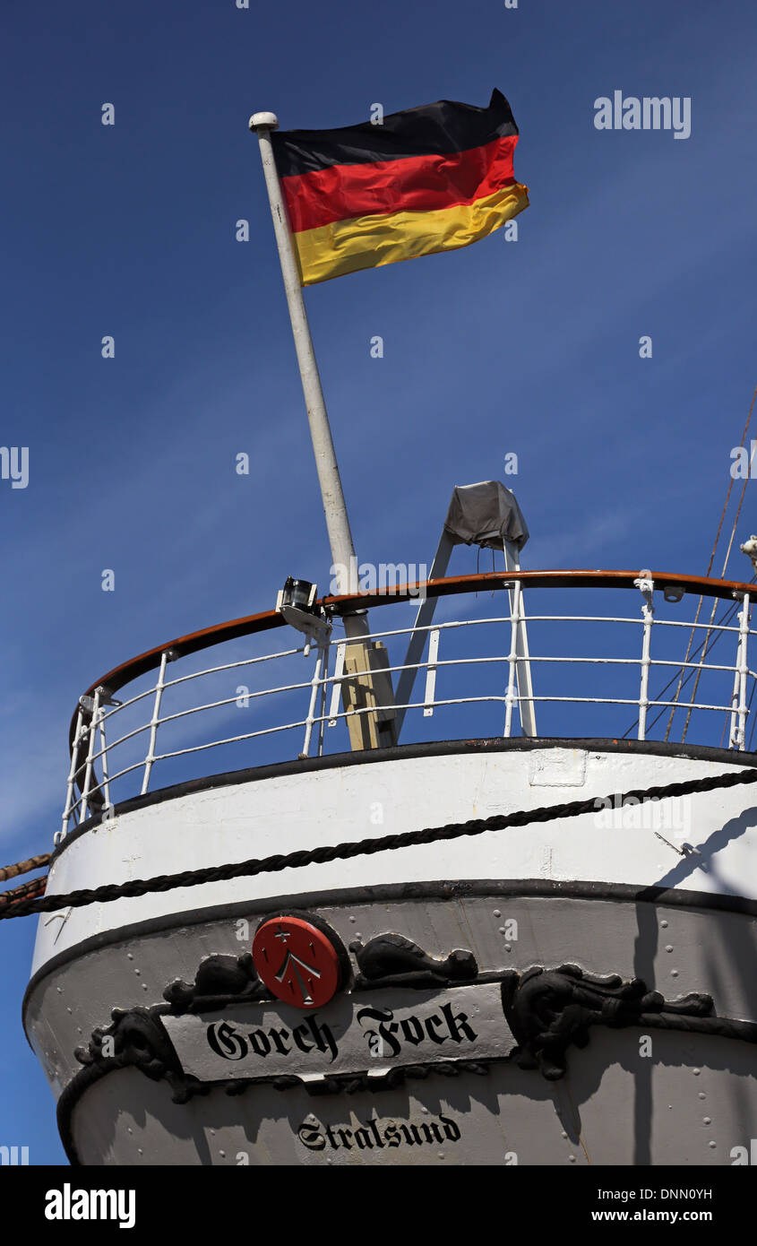 Stralsund, Germany, German national flag flies at the stern of the sailing school ship Gorch Fock I Stock Photo