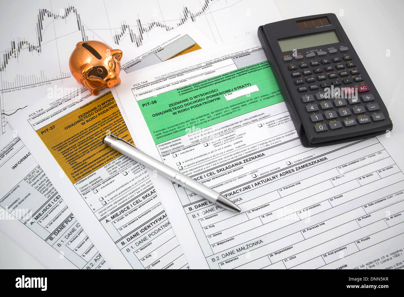 Polish tax forms with calculator and piggybank Stock Photo Alamy