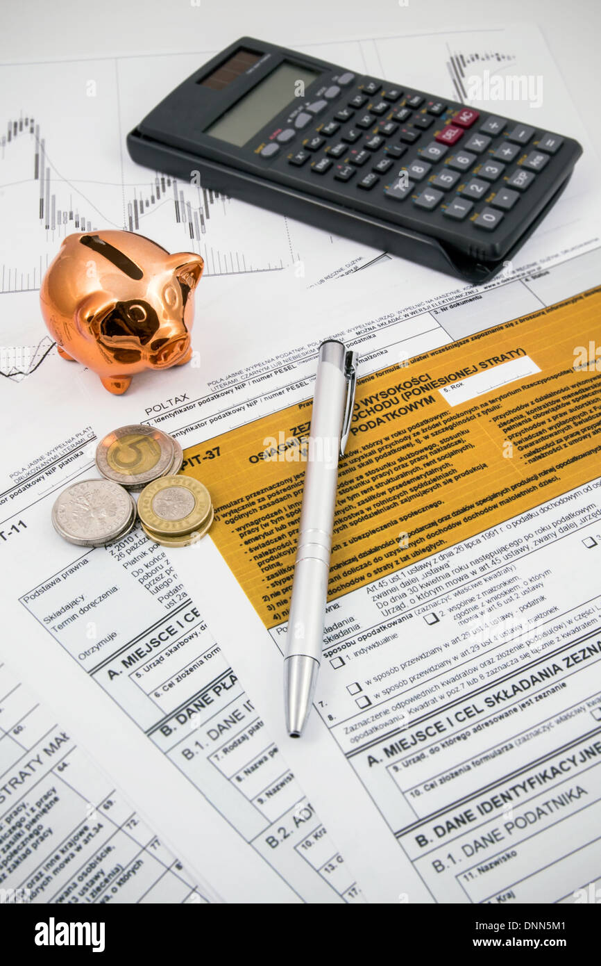 Polish tax forms with calculator and piggybank Stock Photo Alamy