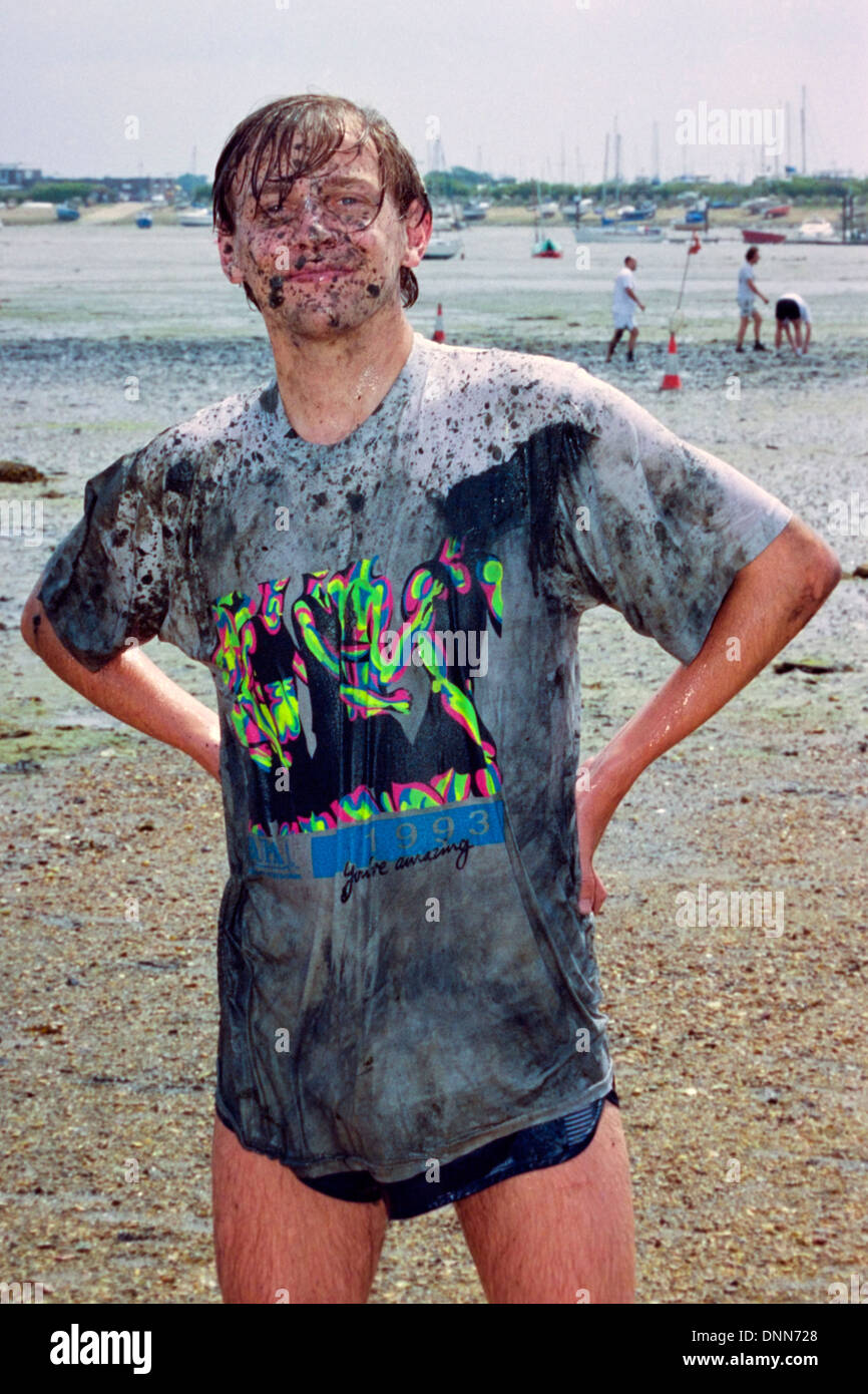 man poses during traditional game of mud football on langstone locks