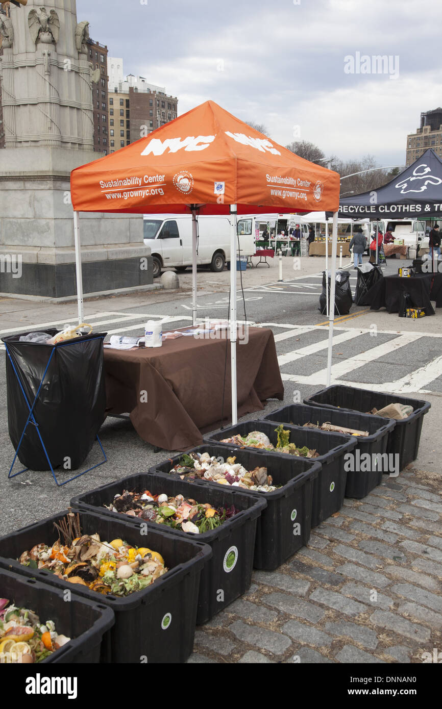 People bring their food scraps to the compost collecting station at the farmers market at Grand army Plaza in Brooklyn, NY. Stock Photo