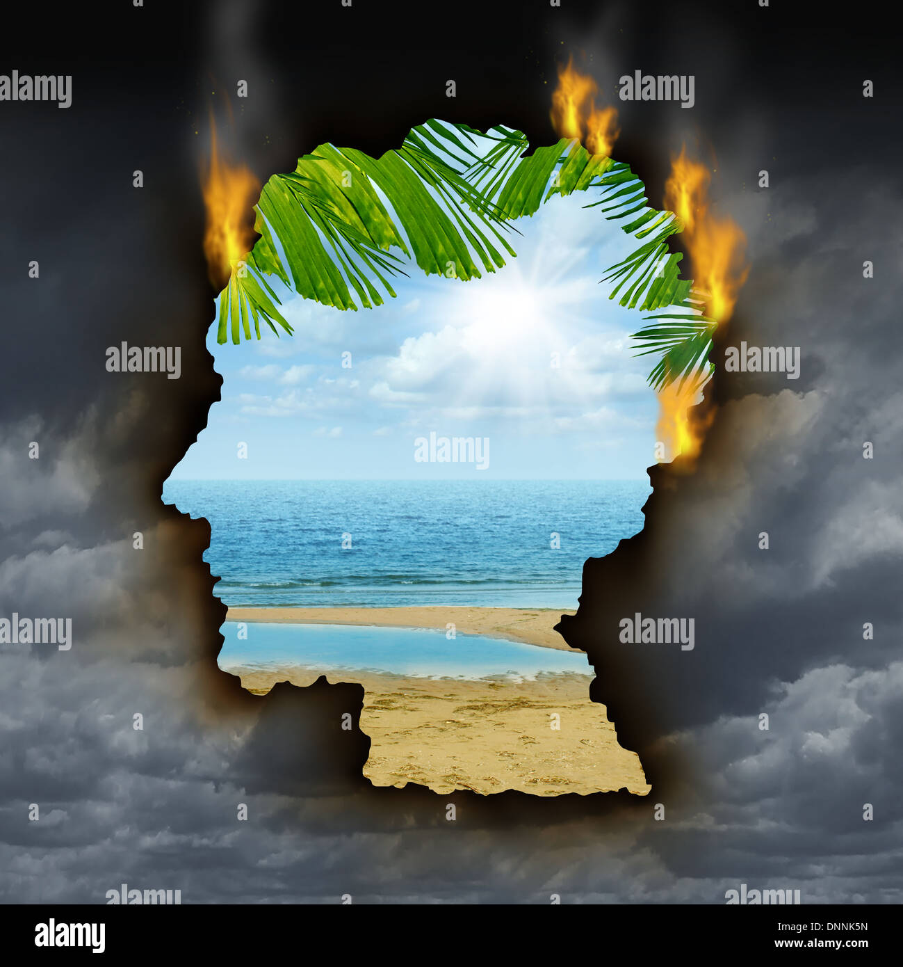 Human escape emotions and feelings concept with a dark grey storm sky burning a hole shaped as a head revealing a beautiful tropical landscape as a metaphor for brain relaxation to overcome depression stress and anxiety. Stock Photo
