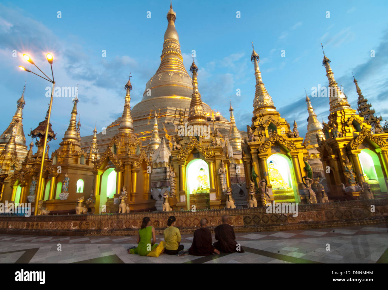 Early evening prayers at the Shwedagon pagoda in Yangon. Stock Photo