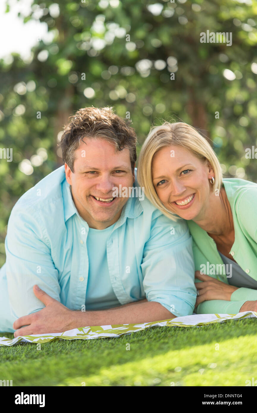 Couple lying on grass Stock Photo