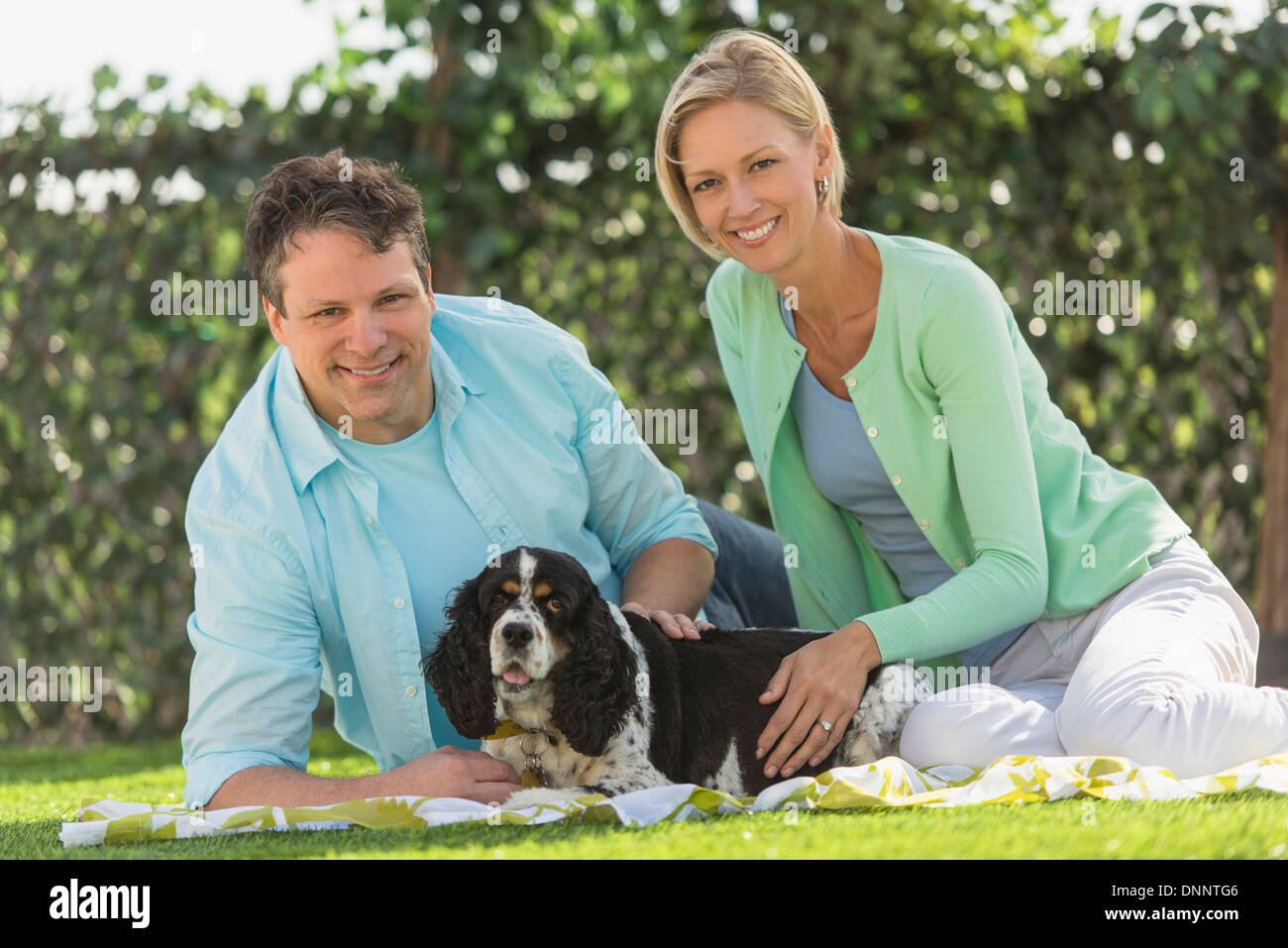 Mature couple lying on grass hi-res stock photography and images - Alamy