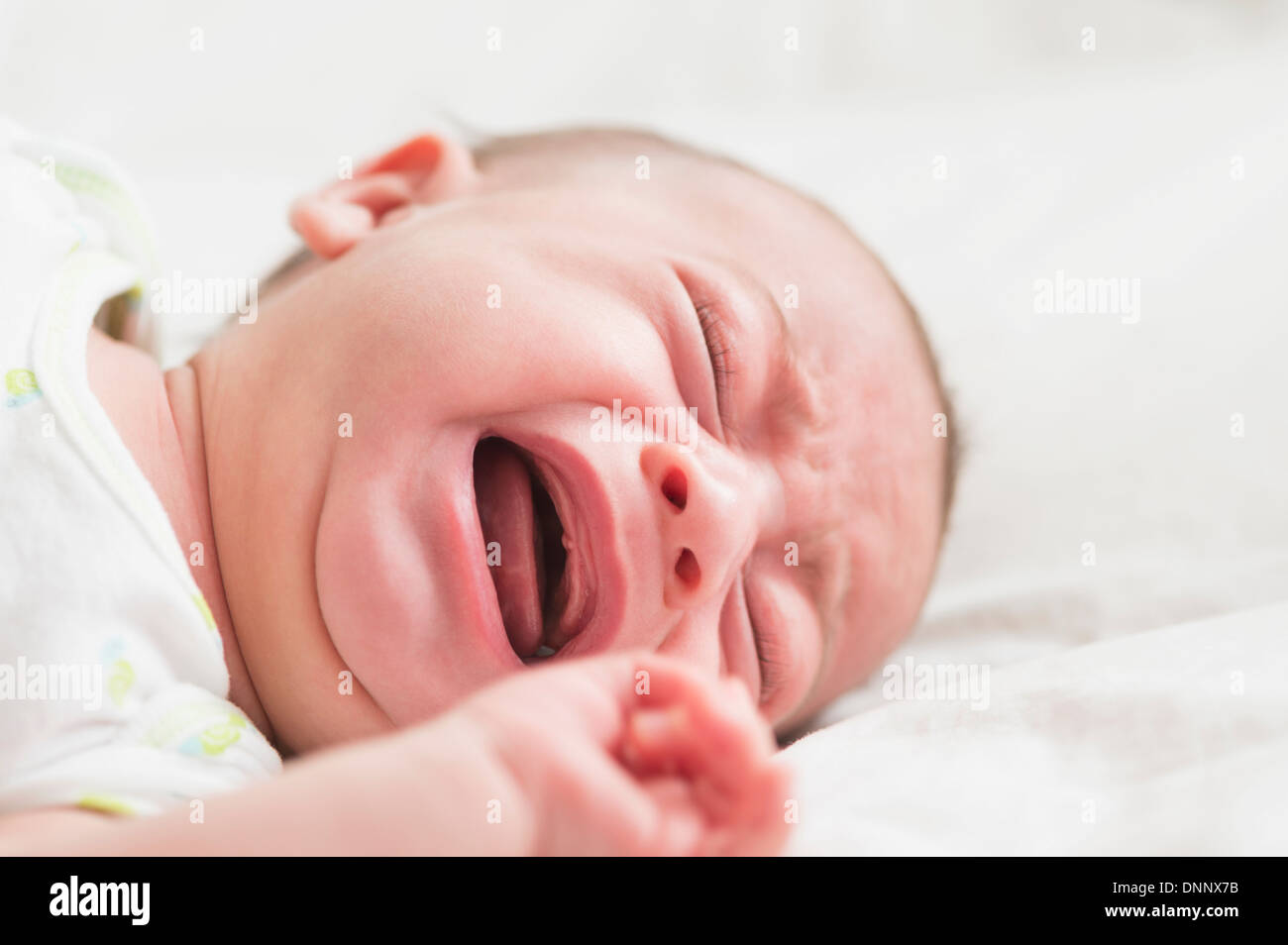 Baby boy (2-5 months) crying Stock Photo